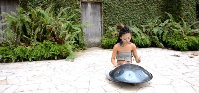 Watch this woman perform jaw-dropping music with just her hands and a metallic turtle shell.