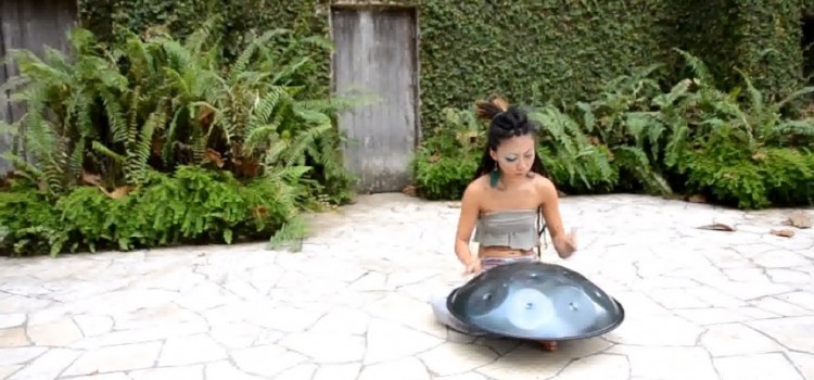 Watch this woman perform jaw-dropping music with just her hands and a metallic turtle shell.